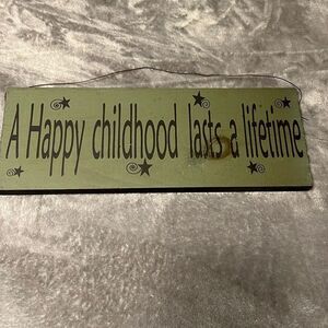 “A Happy Childhood Lasts a Lifetime” Wooden Sign